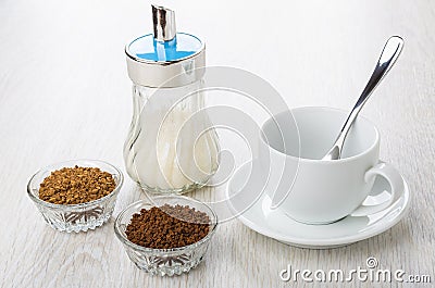 Bowl with instant freeze-dried coffee, cup, sugar bowl, spoon Stock Photo