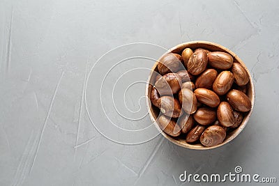 Bowl of jackfruit seeds on light table, top view. Space for text Stock Photo