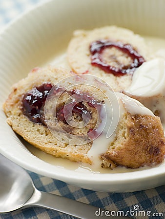 Bowl of Jam Roly Poly and Custard Stock Photo