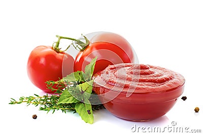 Bowl of ketchup or tomato sauce with ingredients on white Stock Photo