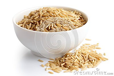 Bowl of long grain brown rice isolated on white. Stock Photo