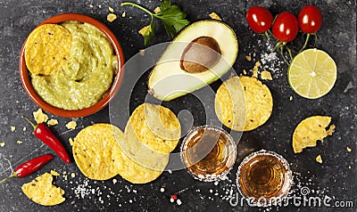 Bowl of mexican nachos chips with homemade fresh guacomole sauce Stock Photo