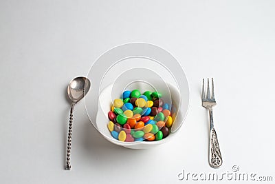 A bowl of multicolor chocolate candies Stock Photo