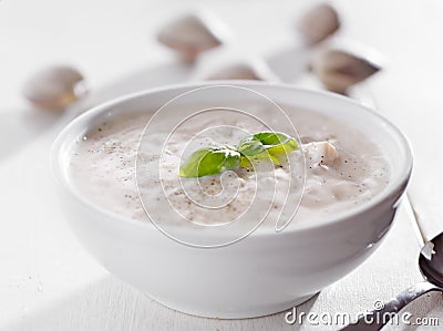 Bowl of new england chowder with basil garnish. Stock Photo