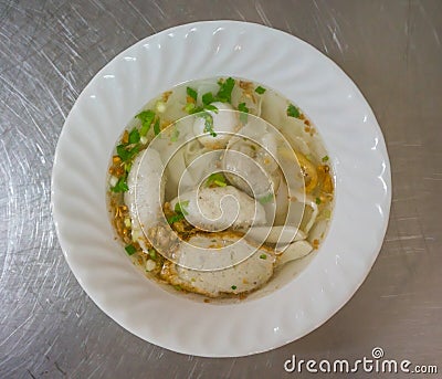 A bowl of noodle with variety of fish balls in Thai style on sta Stock Photo