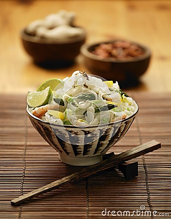 Bowl of Oriental asparagus prawn and noodle stir fry Stock Photo