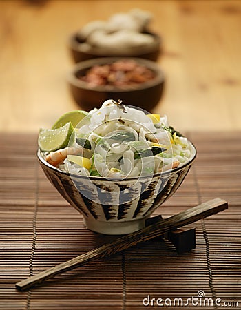 Bowl of Oriental asparagus prawn and noodle stir fry Stock Photo