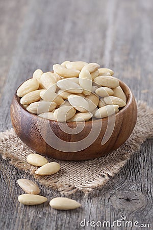 Bowl with peeled almonds Stock Photo