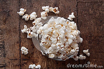 A bowl of popcorn on a wooden table Stock Photo