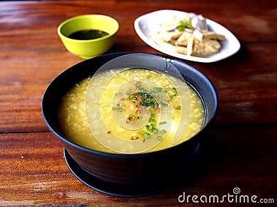 Bowl of porridge or congee Stock Photo