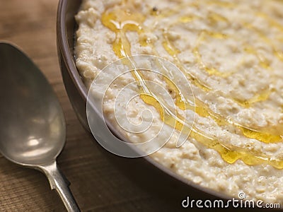 Bowl of Porridge with Golden Syrup Stock Photo