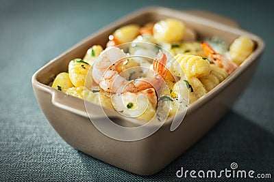 Bowl of prawns in Italian gnocchi pasta Stock Photo