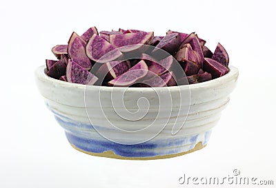 Bowl of Quartered Purple Potatoes Stock Photo