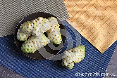 Bowl of Raw Noni Fruit in Peru Stock Photo