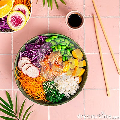 Bowl with salmon, rice and fresh vegetables poke. Square Stock Photo