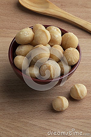 Bowl with salted macadamia nuts close up Stock Photo