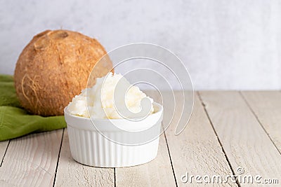 Bowl of Scooped Solidified Coconut Oil A Healthy Alternative to Vegetable Oils Stock Photo