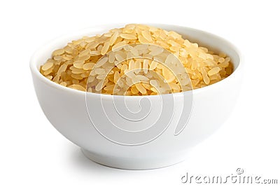 Bowl of short grain parboiled rice. Stock Photo