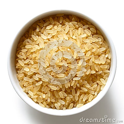 Bowl of short grain parboiled rice on white. Stock Photo