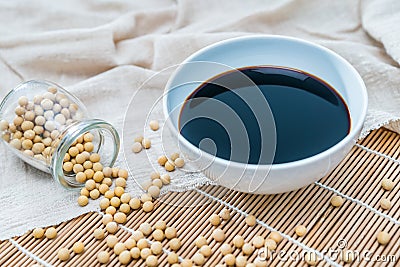 A bowl of soy sauce and sprinkled soybeans Stock Photo