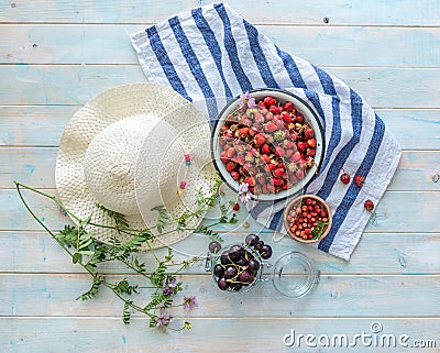 Bowl with strawberries and ripe cherries, topview Stock Photo