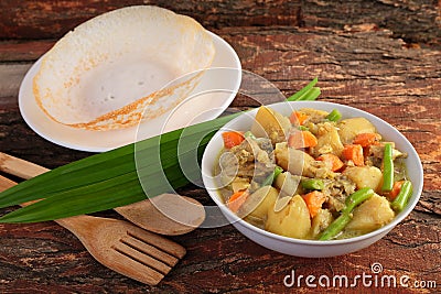 Bowl of Tasty Mutton curry and appam Stock Photo