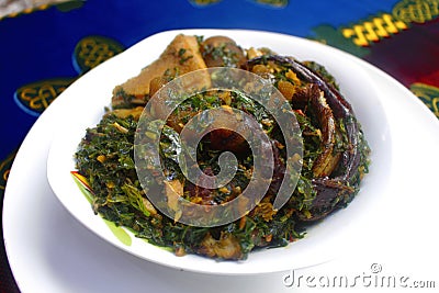 A bowl of tasty thick Vegetable soup with fish and meat Stock Photo