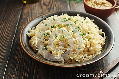 A bowl with traditional German Sauerkraut served in rustic style Stock Photo