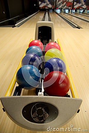 Bowling balls at alley Stock Photo