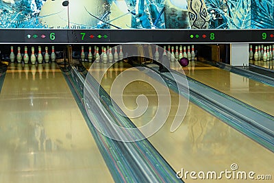 Bowling lanes with balls and pins. Bowling center Editorial Stock Photo