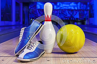 Bowling shoes and bowling ball on the game track close-up Stock Photo
