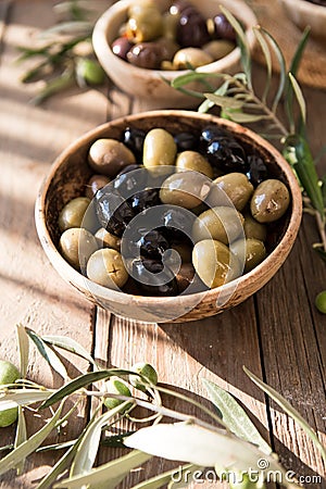 Bowls with different kind of olives green , black, kalamata on table Stock Photo