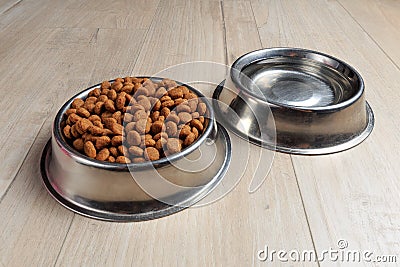 Bowls with dog food and water Stock Photo
