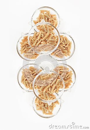 Bowls of dried pasta noodles. Stock Photo