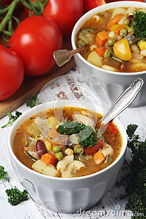 Bowls with Italian soup minestrone Stock Photo