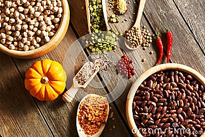 Bowls and spoons of various legumes Stock Photo