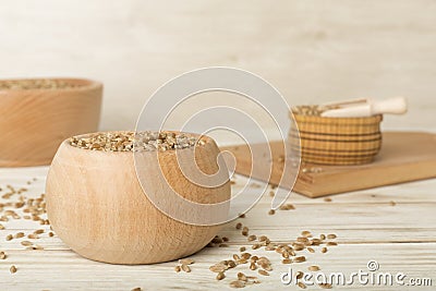 Bowls with wholegrain spelt farro on wooden table Stock Photo