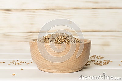 Bowls with wholegrain spelt farro on wooden table Stock Photo