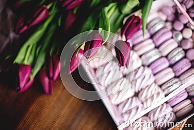 Zephyr, macaroons and tulips. Stock Photo