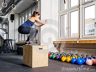 Box jump at the gym Stock Photo