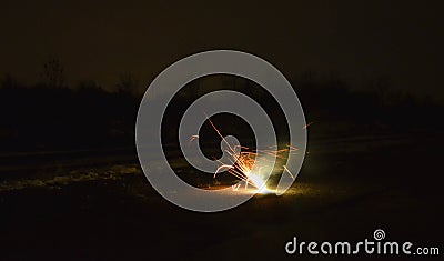 Box with night explosion full of explosive pyrotechnics. white orange fireball in the shape of a white bush with lots of hot shard Stock Photo