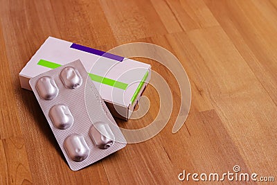 A box of pills. A plate of pills. Packing with tablets Stock Photo