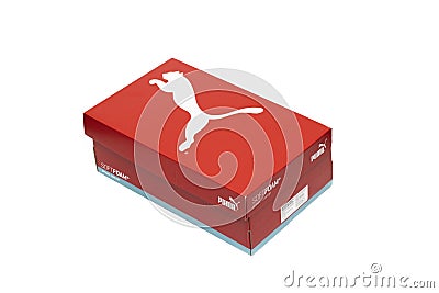 A box of red Puma brand shoes, isolated on a white background. Editorial Stock Photo