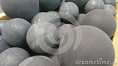 Box of squash and racket balls Stock Photo