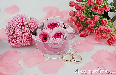 Box surprise gift pink with bow with wedding rings Stock Photo