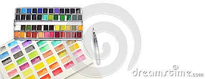 Box with watercolors, brush and palette on a light gray background Stock Photo