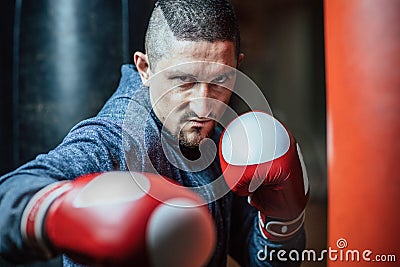Boxer delivers a deft hit. Promotional picture for boxing. Stock Photo