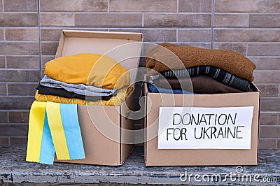 Boxes with humanitarian aid for Ukrainian refugees on the street. Editorial Stock Photo