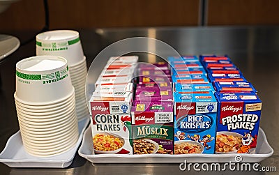 Shelf with boxes of instant oatmeal, corn flakes in various flavors.A quick healthy fast breakfast food offered in a bar Editorial Stock Photo