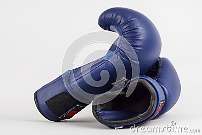 Boxing blue gloves on a gray background. Fitness still life on a white background Stock Photo